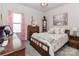 Bedroom with soft pink accents and a vintage feel at 9541 Festival Way, Charlotte, NC 28215