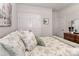 Cozy bedroom with floral bedding, neutral walls and unique artwork at 9541 Festival Way, Charlotte, NC 28215