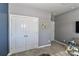 A double door closet is in this view of the home at 9541 Festival Way, Charlotte, NC 28215
