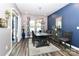 Dining room with dark wood table, modern chandelier, and natural light at 9541 Festival Way, Charlotte, NC 28215