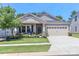 Charming single-Gathering home with a well-manicured lawn, lovely front porch, and attached two-car garage at 9541 Festival Way, Charlotte, NC 28215