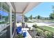 Charming covered front porch with stone pillars, comfortable seating, and view of neighborhood street at 9541 Festival Way, Charlotte, NC 28215