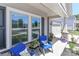 Cozy front porch with seating, decorative pillows, and a view of the well-maintained front yard and neighborhood at 9541 Festival Way, Charlotte, NC 28215