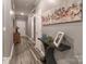 Bright hallway with sleek floors, modern decor, and stylish artwork, leading to various rooms at 9541 Festival Way, Charlotte, NC 28215