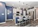 Modern kitchen featuring stainless steel appliances, granite countertops, and a large island with seating at 9541 Festival Way, Charlotte, NC 28215