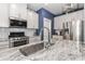 Modern kitchen features granite countertops, stainless steel appliances, and white cabinets at 9541 Festival Way, Charlotte, NC 28215