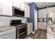 Kitchen with granite counters, stainless appliances and white cabinets and tile backsplash at 9541 Festival Way, Charlotte, NC 28215