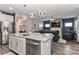 Open concept kitchen with stainless steel appliances flows into the living room at 9541 Festival Way, Charlotte, NC 28215