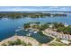 Beautiful aerial view of lakeside condos, boat docks, and serene waters, offering a waterfront living experience at 1007 Southwest Dr, Davidson, NC 28036