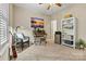 This bedroom features a desk, chair, bookshelf, and carpeted floors at 1007 Southwest Dr, Davidson, NC 28036