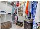 Walk-in closet includes shelving, hanging rods, and a sitting bench at 1007 Southwest Dr, Davidson, NC 28036