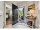 Welcoming entryway with tiled floor, decorative table, and view to bedroom and outdoor landscape at 1007 Southwest Dr, Davidson, NC 28036