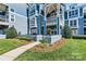 Well-maintained condo building with private patios and lush landscaping at 1007 Southwest Dr, Davidson, NC 28036