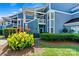 Beautiful condo building with well-manicured landscaping and a welcoming entrance at 1007 Southwest Dr, Davidson, NC 28036