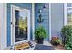 Inviting front entrance with a glass door, decorative anchor, and lush plants at 1007 Southwest Dr, Davidson, NC 28036
