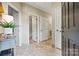 Bright hallway showcasing neutral color palette, tiled floor, and access to rooms at 1007 Southwest Dr, Davidson, NC 28036