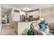 A modern kitchen with stainless steel appliances, countertops, and adjoining living room at 1007 Southwest Dr, Davidson, NC 28036