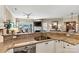 Open concept kitchen with granite countertops overlooks the living room and fireplace at 1007 Southwest Dr, Davidson, NC 28036