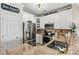 The kitchen features stainless steel appliances, custom cabinets, and granite countertops at 1007 Southwest Dr, Davidson, NC 28036