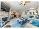 An open concept living room with modern furniture, fireplace, and access to dining and kitchen at 1007 Southwest Dr, Davidson, NC 28036