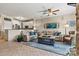 Inviting living room featuring tile floors, comfortable seating, ceiling fan, and access to the kitchen at 1007 Southwest Dr, Davidson, NC 28036
