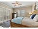 Bright and spacious main bedroom featuring shuttered doors and windows for lots of natural light at 1007 Southwest Dr, Davidson, NC 28036