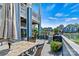 Relaxing patio with outdoor seating, grill, and views of the lake and surrounding community at 1007 Southwest Dr, Davidson, NC 28036