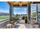 A covered patio with a fan, outdoor seating, and a view of the lake at 1007 Southwest Dr, Davidson, NC 28036