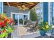 Relaxing covered patio with comfortable seating, ceiling fan, and scenic lake views at 1007 Southwest Dr, Davidson, NC 28036