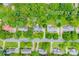 An aerial view captures a serene neighborhood with lush trees, well-maintained homes, and inviting streets at 10918 Megwood Dr, Charlotte, NC 28277