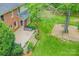 The backyard presents a multi-level deck, mature trees, and a charming fire pit area for relaxation and entertaining at 10918 Megwood Dr, Charlotte, NC 28277