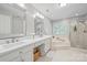 Elegant bathroom with double sink vanity, soaking tub and tiled shower with glass door at 10918 Megwood Dr, Charlotte, NC 28277