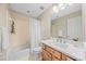 Bathroom featuring a bathtub, a shower, a mirror, a sink, and a vanity at 10918 Megwood Dr, Charlotte, NC 28277