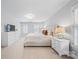 Bright bedroom boasts neutral walls, plush carpet, natural light, and stylish furnishings at 10918 Megwood Dr, Charlotte, NC 28277