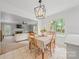 Dining area with view into open concept living room at 10918 Megwood Dr, Charlotte, NC 28277