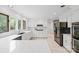 An open concept kitchen features sleek countertops and stainless appliances at 10918 Megwood Dr, Charlotte, NC 28277