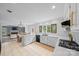 Open concept kitchen and dining area with seamless flow to living space at 10918 Megwood Dr, Charlotte, NC 28277
