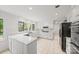 Bright kitchen features white cabinetry, marble countertops, and stainless appliances at 10918 Megwood Dr, Charlotte, NC 28277