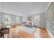 Spacious living room featuring hardwood floors, neutral colors, and ample natural light at 10918 Megwood Dr, Charlotte, NC 28277