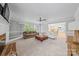 Spacious living room with fireplace and a view of the kitchen at 10918 Megwood Dr, Charlotte, NC 28277