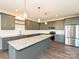 Stylish kitchen showcasing granite countertops, stainless steel appliances, and pendant lighting over the island at 11507 Valley Oak Ln, Stanfield, NC 28163