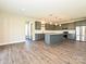 Modern kitchen featuring granite countertops, stainless steel appliances, and ample cabinet space at 11507 Valley Oak Ln, Stanfield, NC 28163