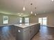 Gourmet kitchen featuring a granite island, stainless steel appliances, and an open floor plan at 11507 Valley Oak Ln, Stanfield, NC 28163