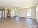 Bright living room with wood floors, large windows, and an open layout for easy entertaining at 11507 Valley Oak Ln, Stanfield, NC 28163