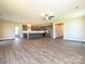 Spacious living area with wood floors, stainless steel appliances, and a modern, open layout at 11507 Valley Oak Ln, Stanfield, NC 28163
