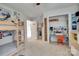 Spacious bedroom featuring a bunk bed, a built in desk area, and a light neutral color palette at 11615 Chadburn Ln, Charlotte, NC 28215