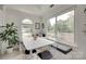 Sunlit dining area featuring a cozy breakfast nook and large windows overlooking the backyard at 11615 Chadburn Ln, Charlotte, NC 28215