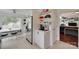 Bright eat-in kitchen featuring modern appliances and seamless flow into an adjacent living space at 11615 Chadburn Ln, Charlotte, NC 28215
