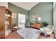 Comfortable sitting room with a cozy rug, plants, and modern furnishings at 11615 Chadburn Ln, Charlotte, NC 28215
