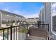 Cozy balcony view of the neighborhood's gray townhomes under a beautiful blue sky at 1204 May Apple Dr, Matthews, NC 28104